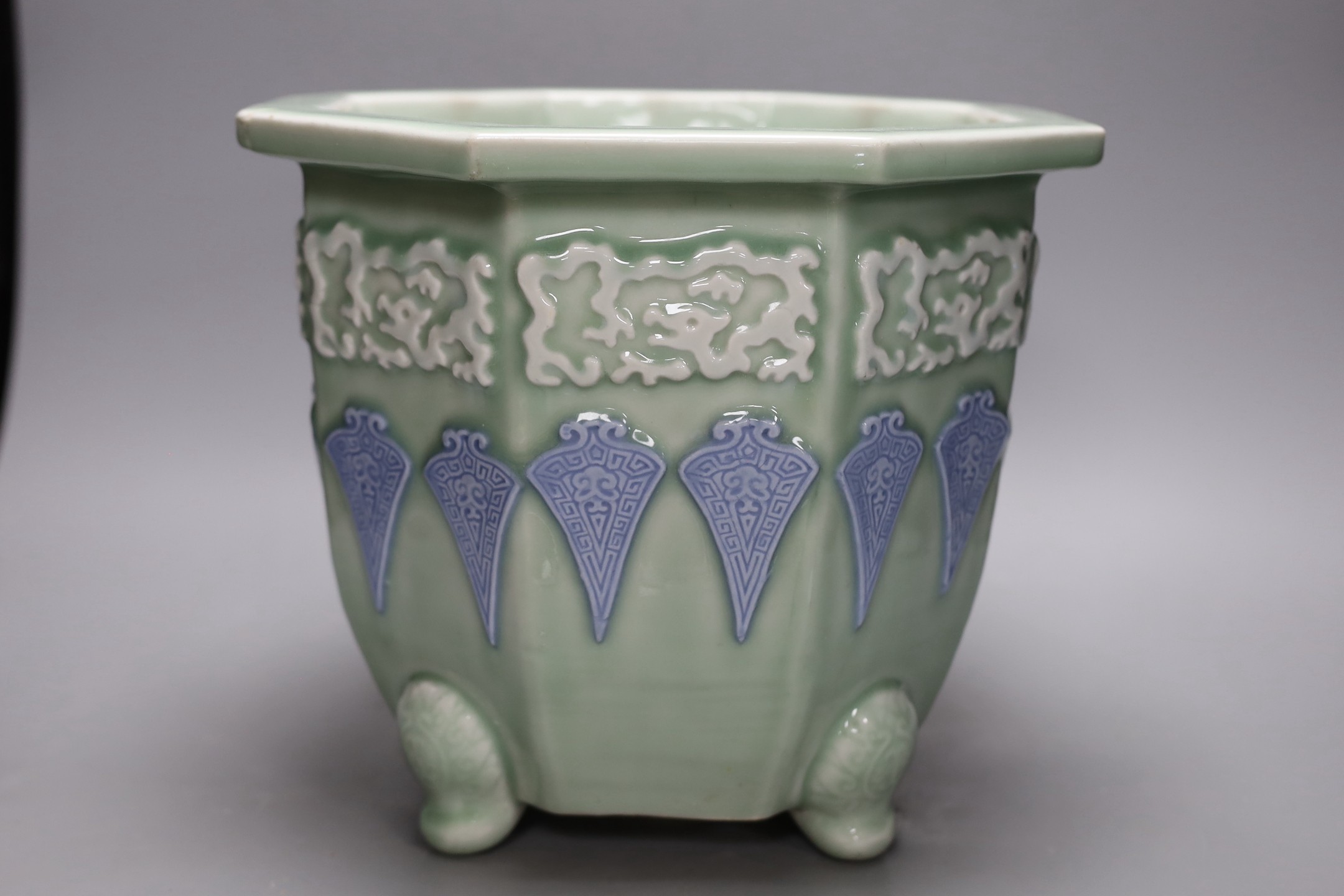 A Japanese celadon ground porcelain jardiniere, 26cm tall